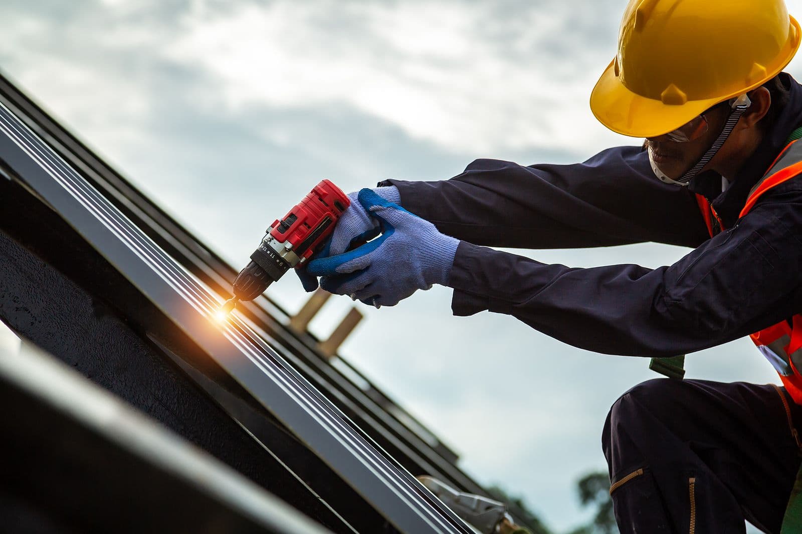 Roofer worker in protective uniform wear and gloves, Construction worker install new roof,