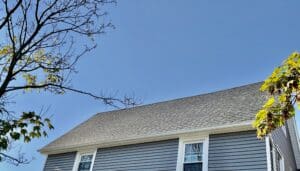 Picture of beautiful new asphalt shingle roofing on a house.